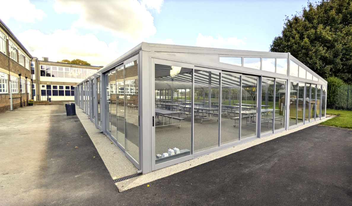 Completed school canopy project creating a large covered outdoor area