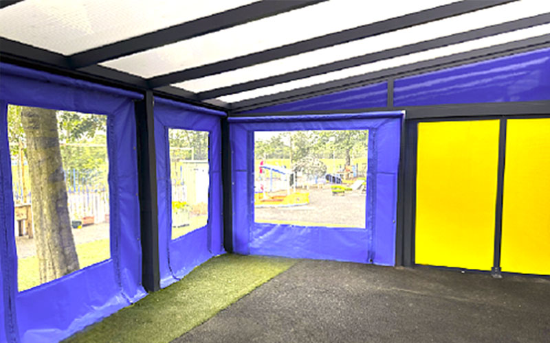 School canopy enclosure with side panels and doors